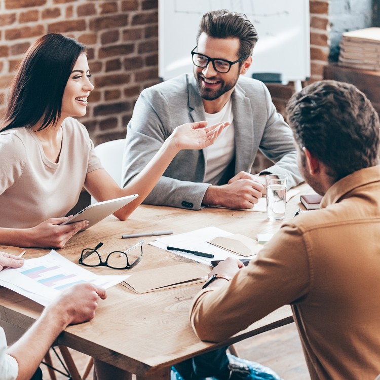 three people in a meeting