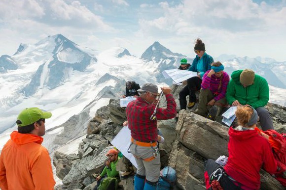 Student on top of mountain