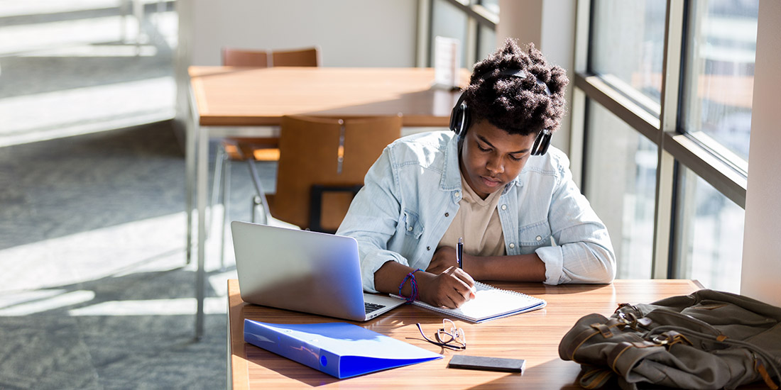 Student studying near a window