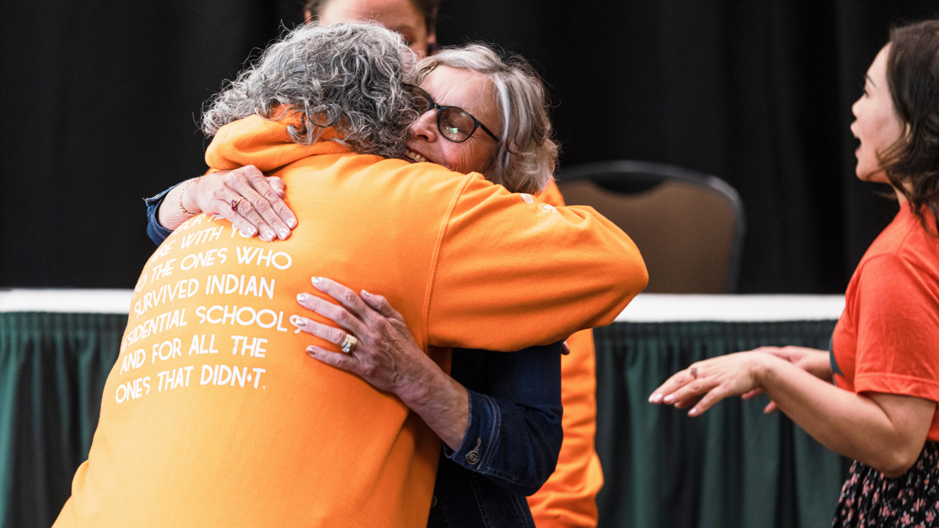 Dorothy Sutton hugs Transition Year Program administrator Lisa Ladouceur at Faculty of Native Studies’ Tea and Bannock.