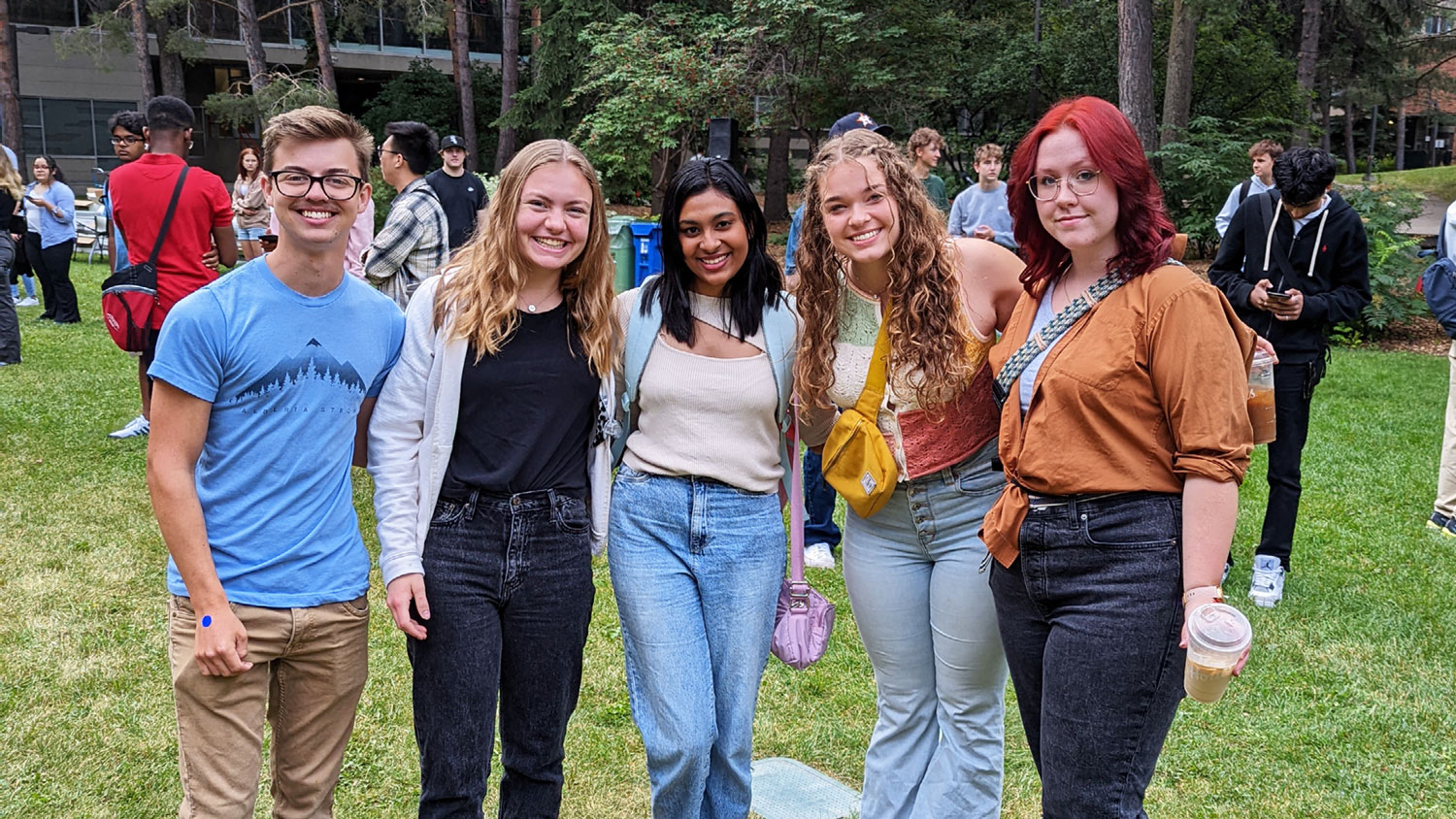 Group of students outside smiling for the camera