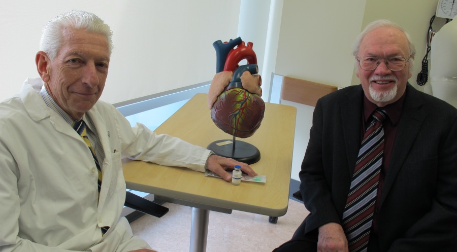 Paul Armstrong, left, poses with study participant Robert Harrison.