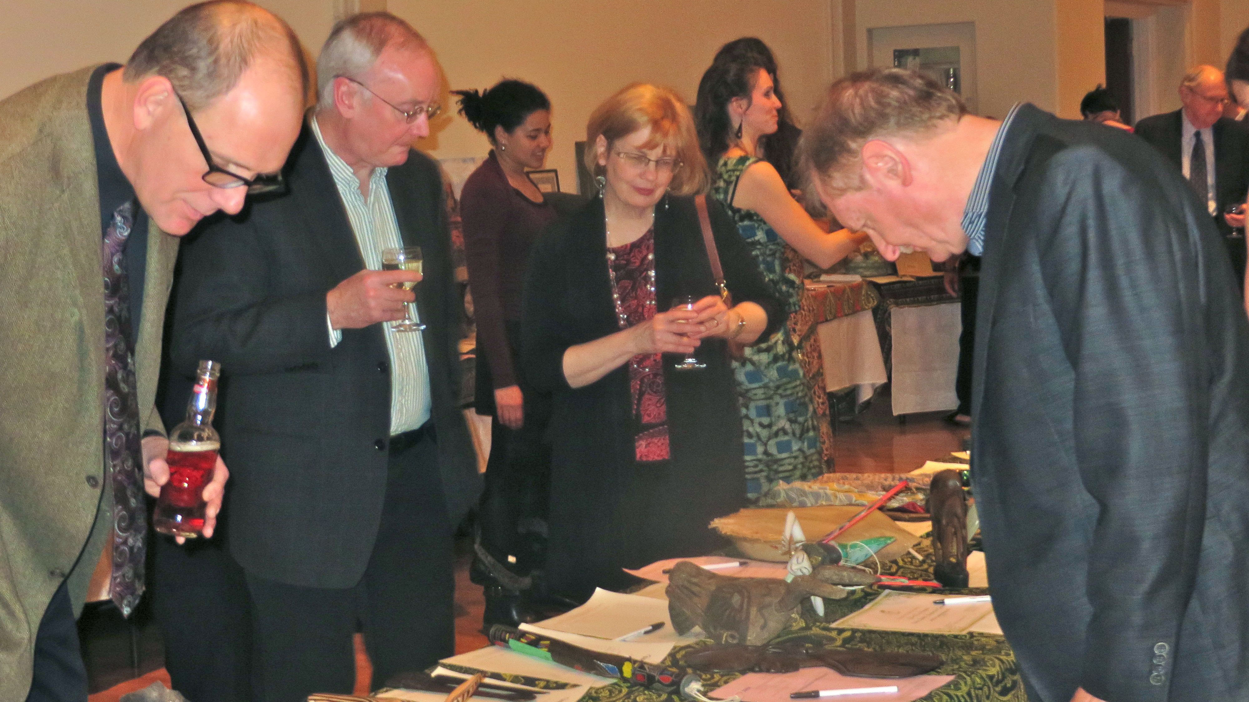 Guest browse silent auction items at Rich Man, Poor Man 2014. Photo: Dr. Kim Solez.