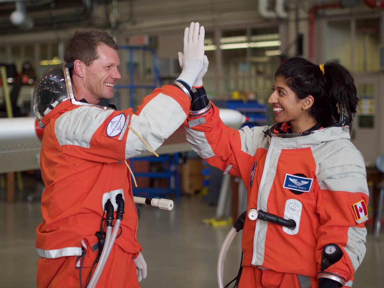 Shawna Pandya (right) gives crewmate Callum Wallach a high-five.