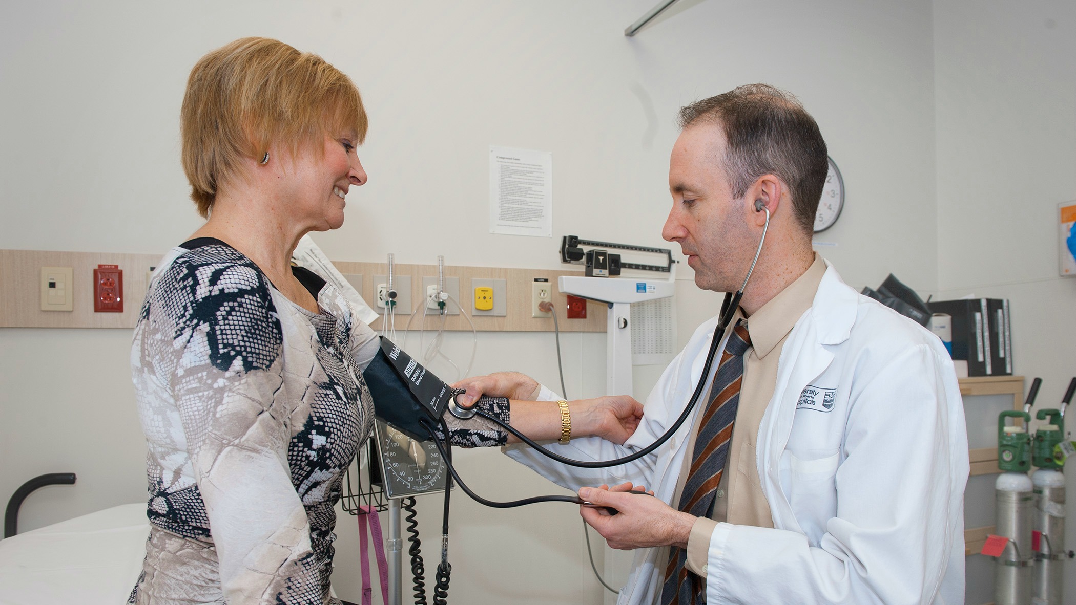 Ian Paterson checks up on study participant Debbie Cameron.