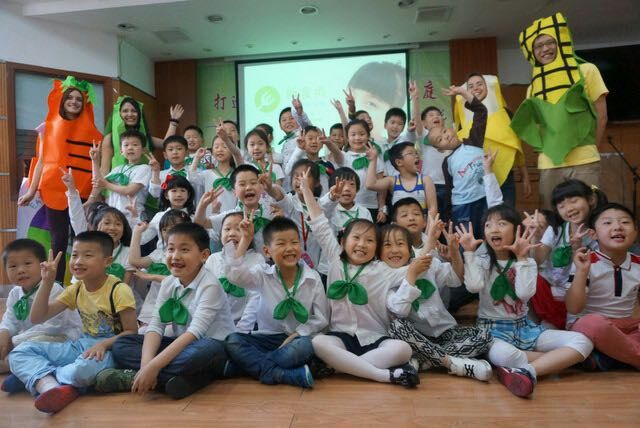 Smiling children and interns