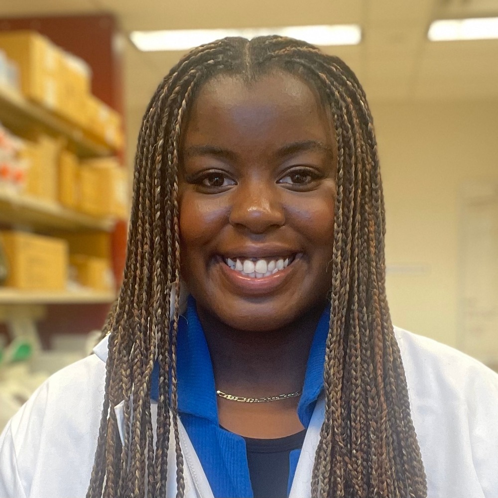 Headshot of Emma Kasinyabo in lab.