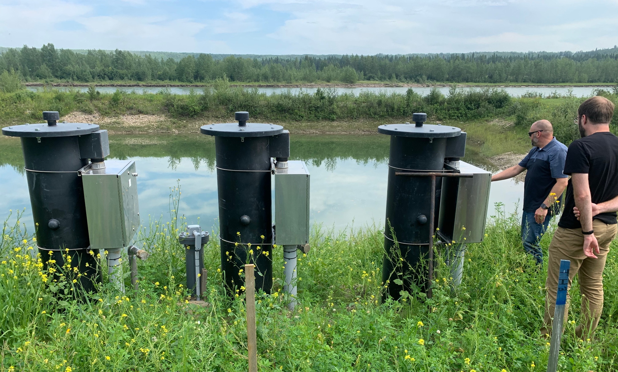 Jason Kopan, ISL Adapt lead water infrastructure engineer, and U of A research associate James Bell inspect pumps that feed raw water from the North Saskatchewan River to the Drayton Valley water treatment plant. (Photo: Douglas Hallett)