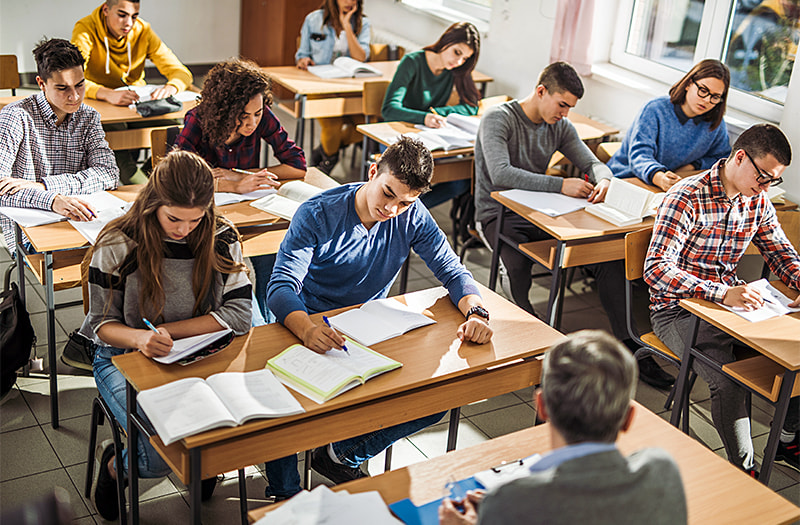 Students taking an exam in a classroom