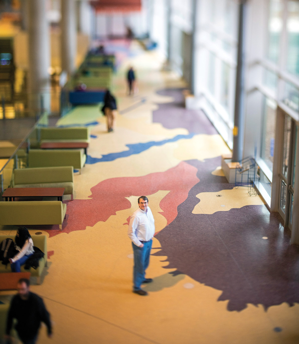 Corridor of people with one man at the center