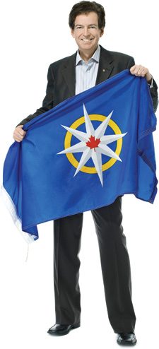 John Geiger holds the flag of the Royal Canadian Geographic Society