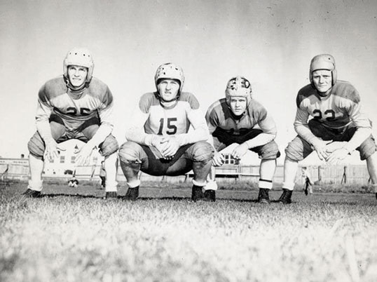 Lougheed playing football with the U of A Golden Bears 