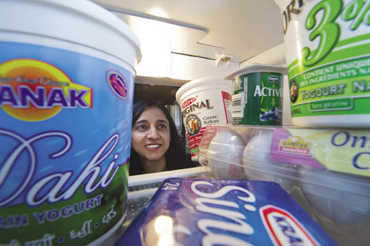 Kamaljit Kaur looking inside a fridge