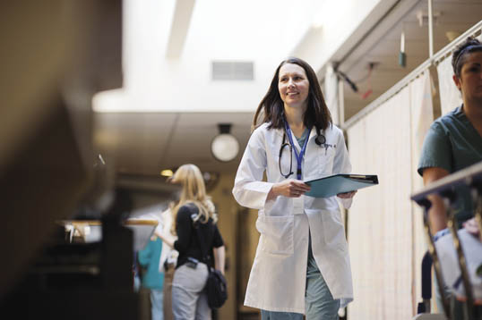 Kathryn Dong doctor walking down hospital corridor