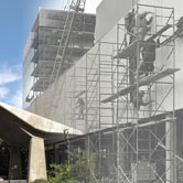 An image of present-day SUB is merged with an archive photo of workers installing the Jordi Bonet sculpture on the south wall [Photo: Richard Siemens]