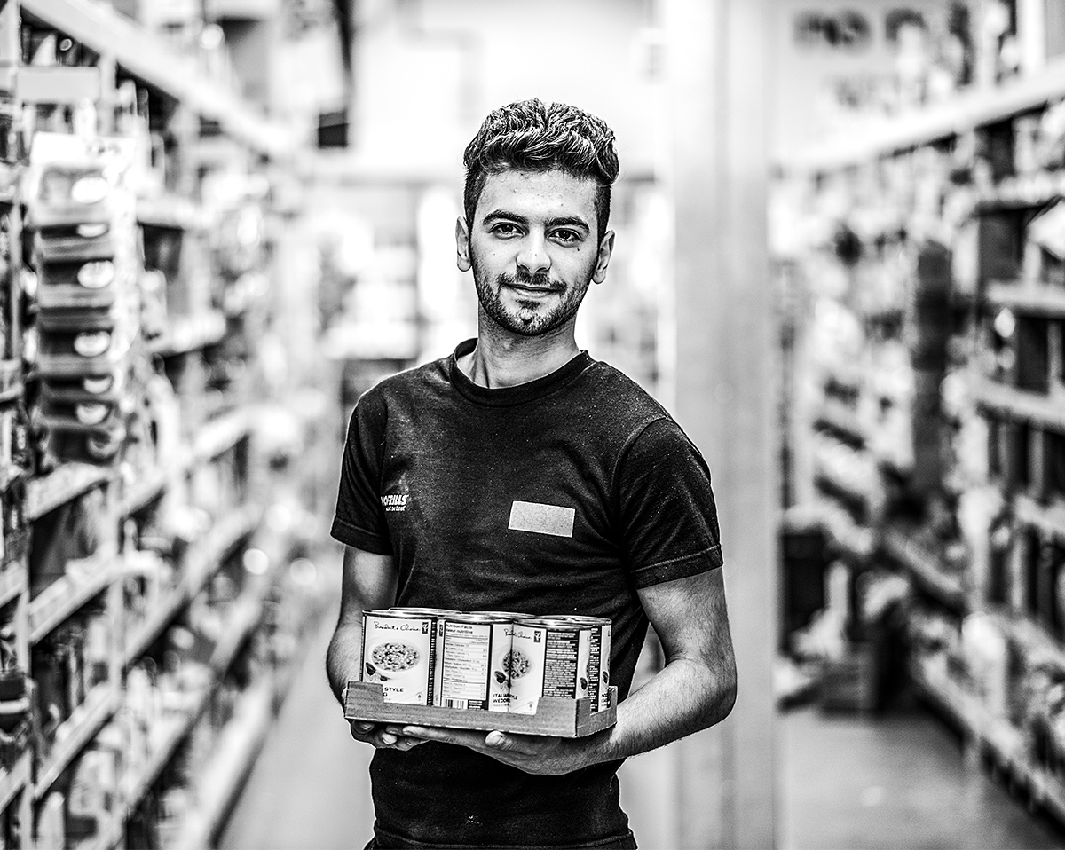 Syrian student working as a stock clerk