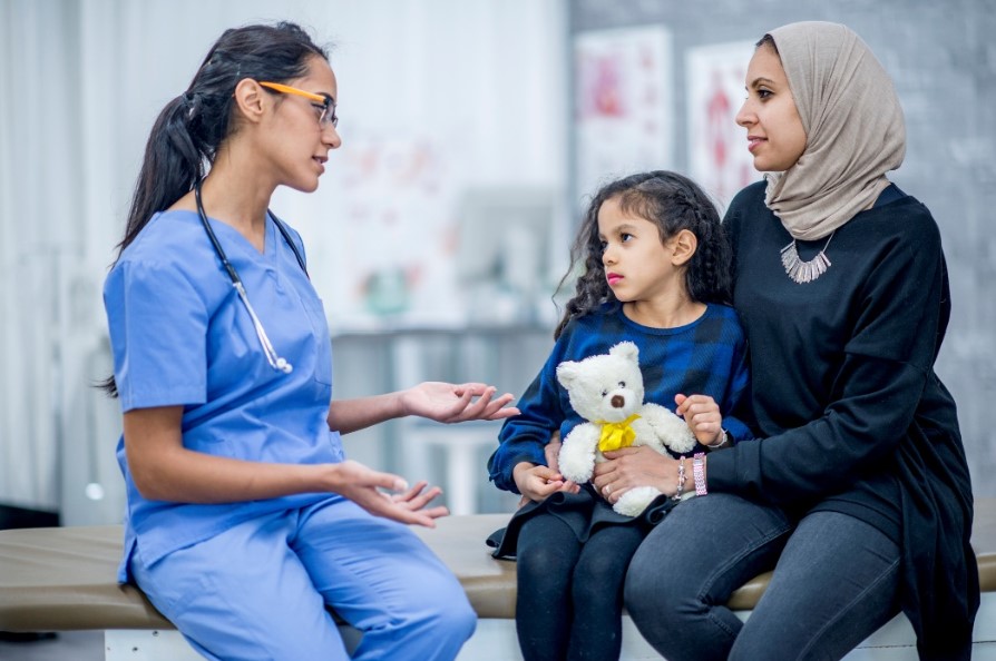 Doctor talking to mother