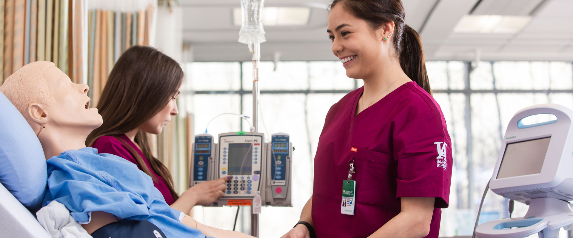 Nursing students interacting with simulation patient