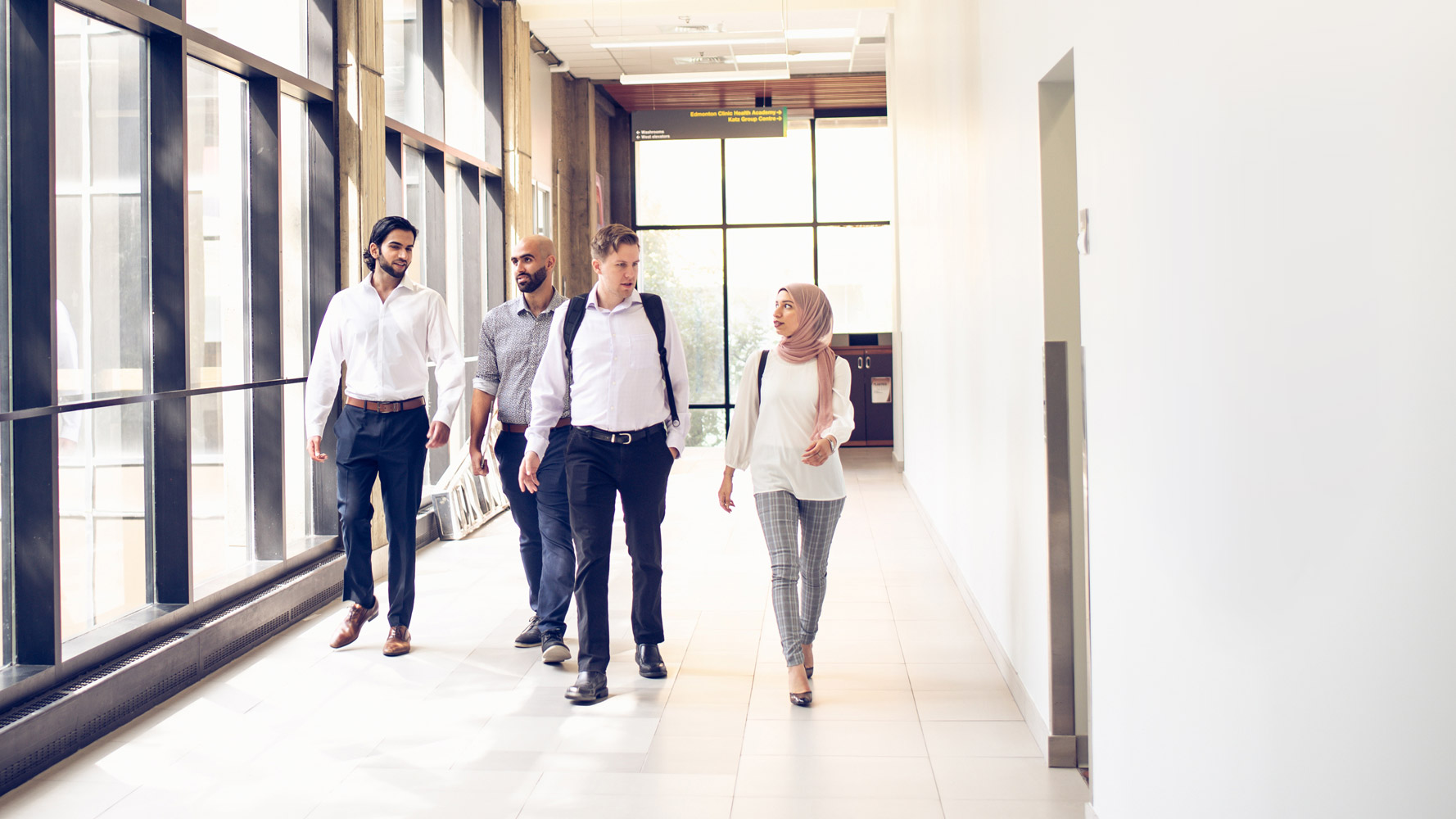 Students walking through the halls of the pharmacy building