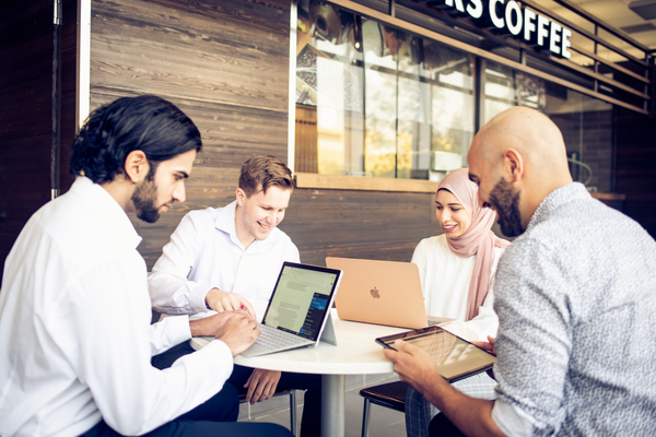 Four people on laptops