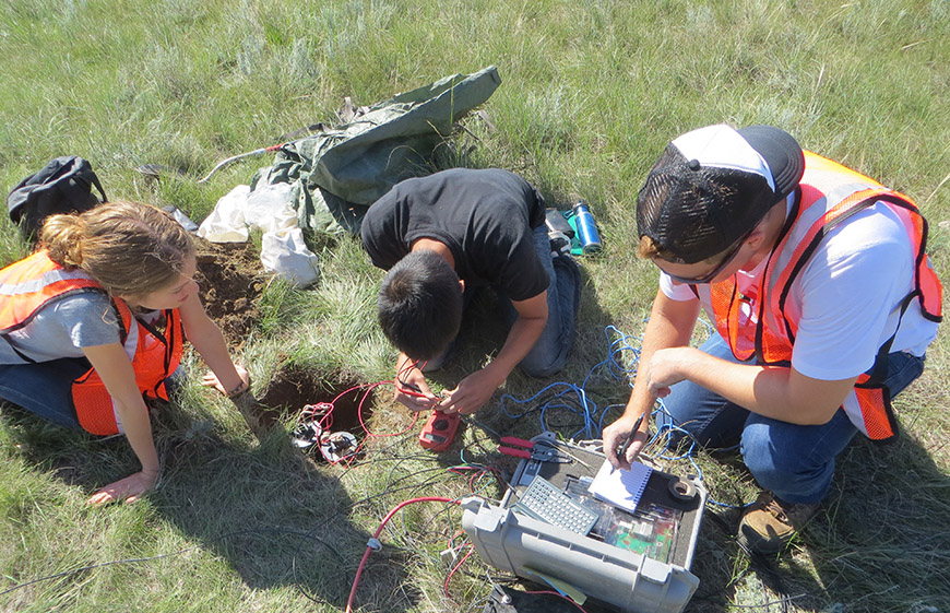 On-site as part of the University of Alberta's Geophysics Field School. Photo supplied by Vadim Kravchinsky.