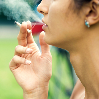 Photo of woman smoking cannabis.