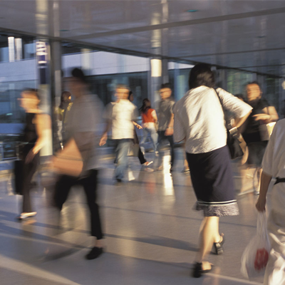 Blurry photo of people walking outside