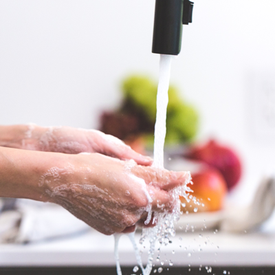 Washing hands at a kitchen sink