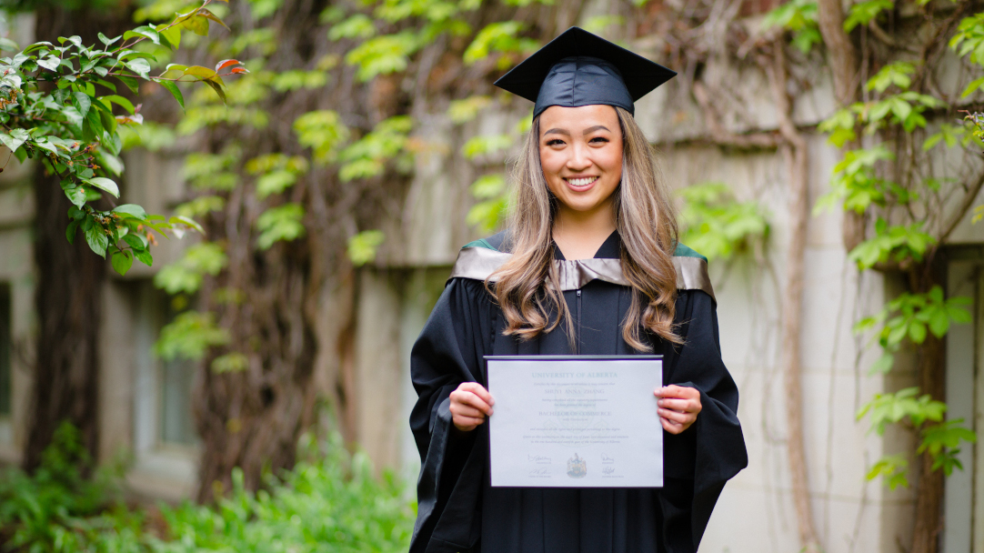 Woman holding her diploma