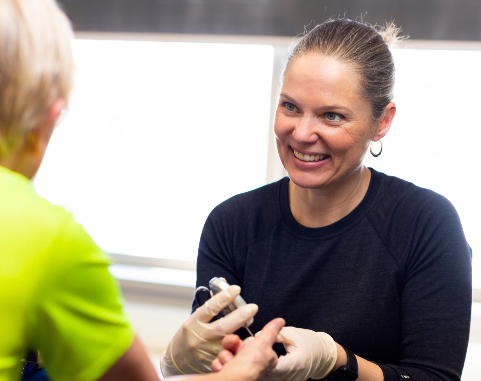 Jane Yardley measuring patient's blood glucose levels