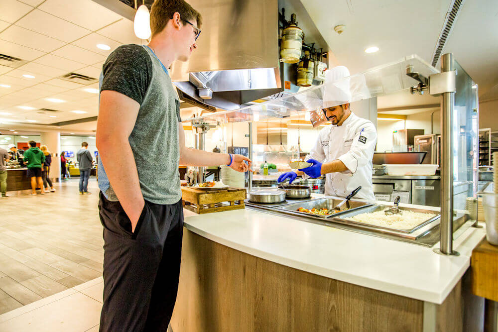 UAlberta student resident eating at Lister dining hall