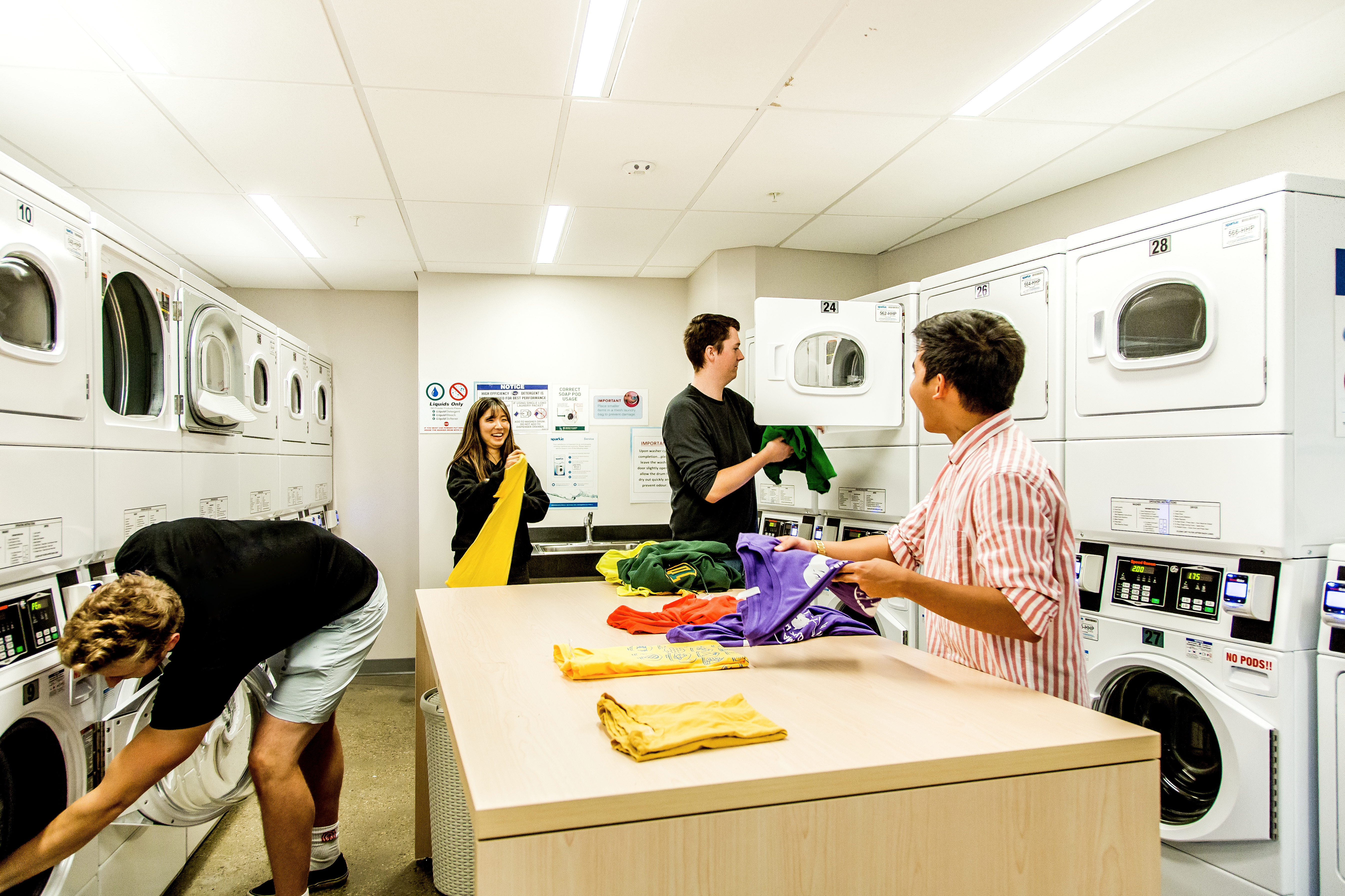 Students doing laundry residence