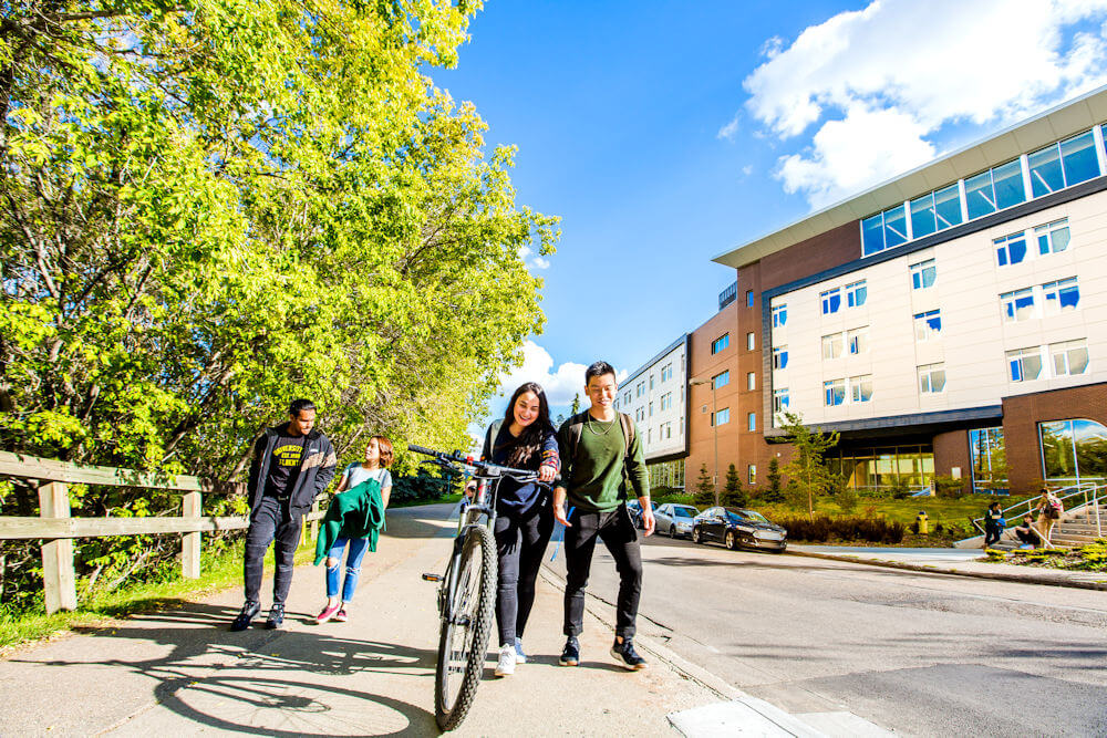 UAlberta student residents walking toward Edmonton's river valley