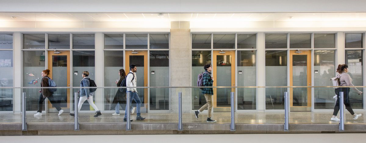 A group of Faculty of Science students walk between labs in the Centennial Centre for Interdisciplinary Science at the University of Alberta