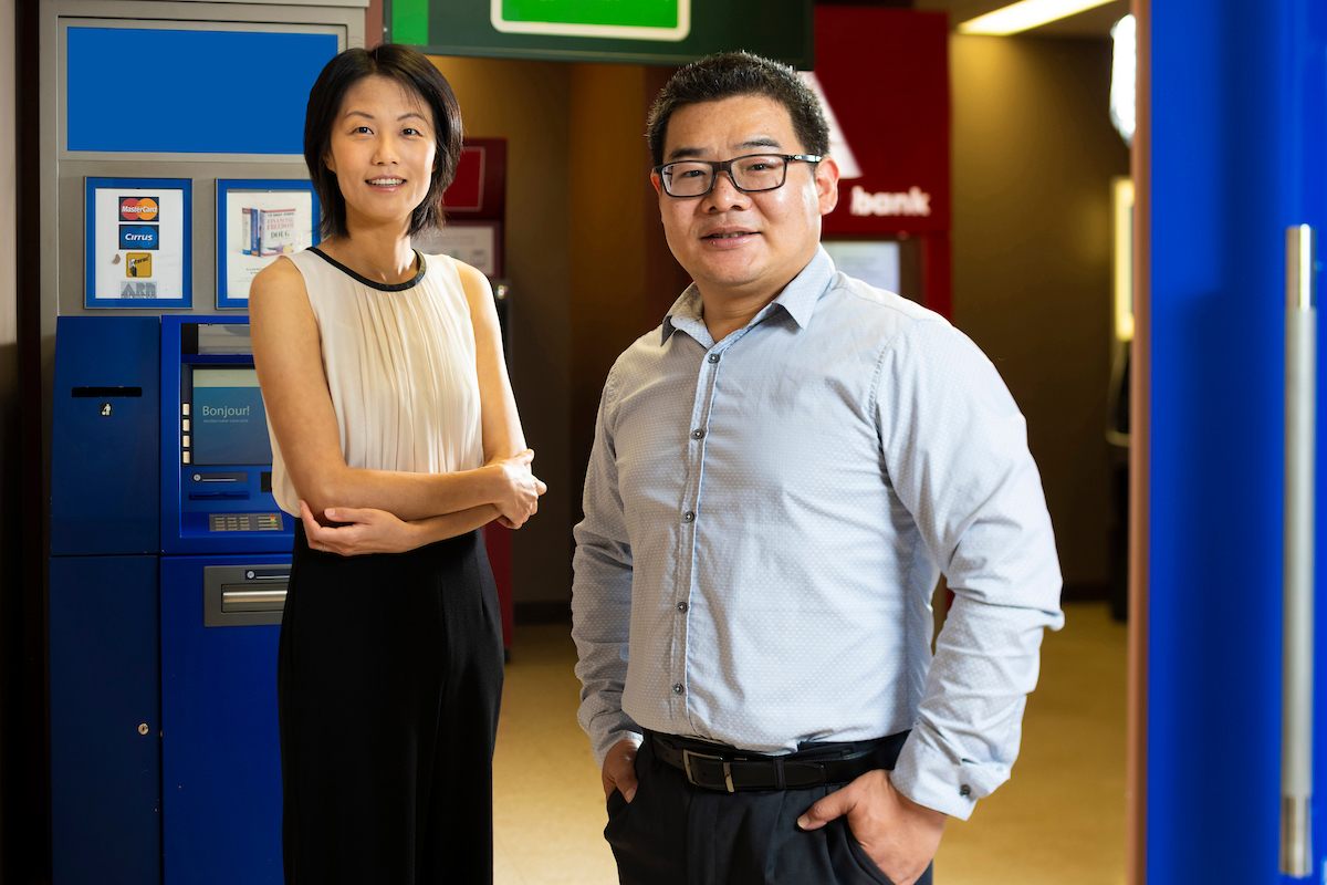 Statisticians and faculty members Bei Jiang and Linglong Kong.