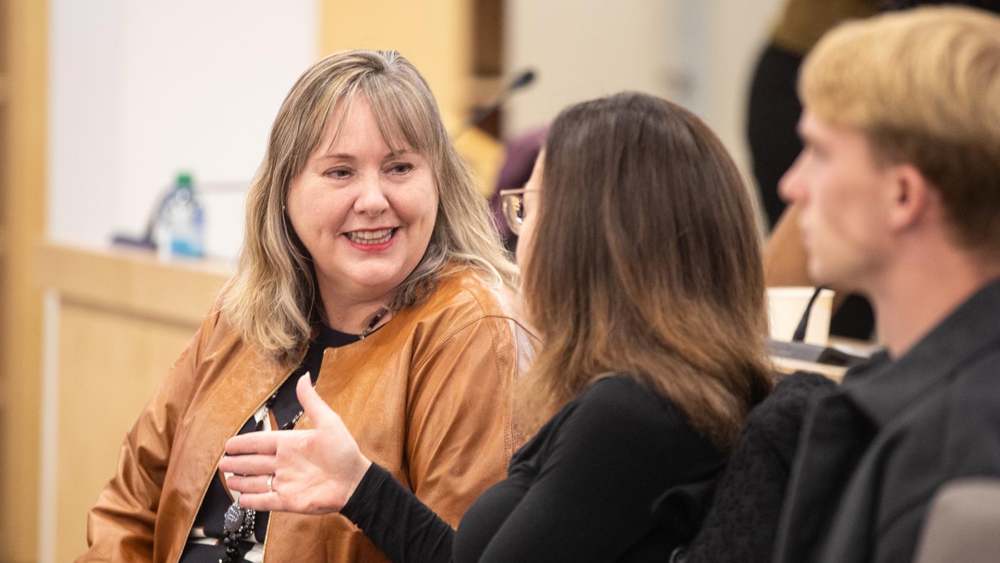 Joanna Harrington chats with other attendees