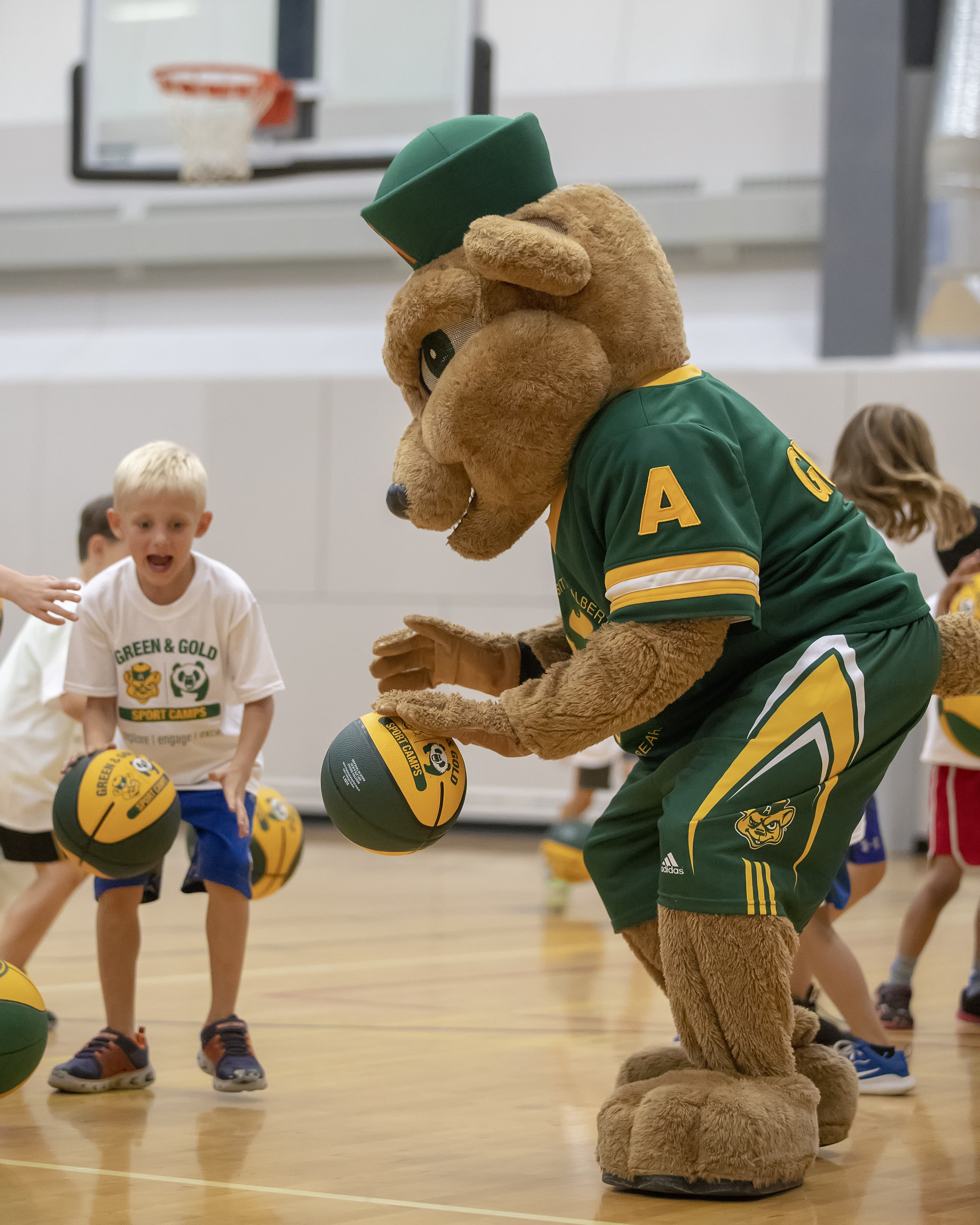 Guba dribbling with campers