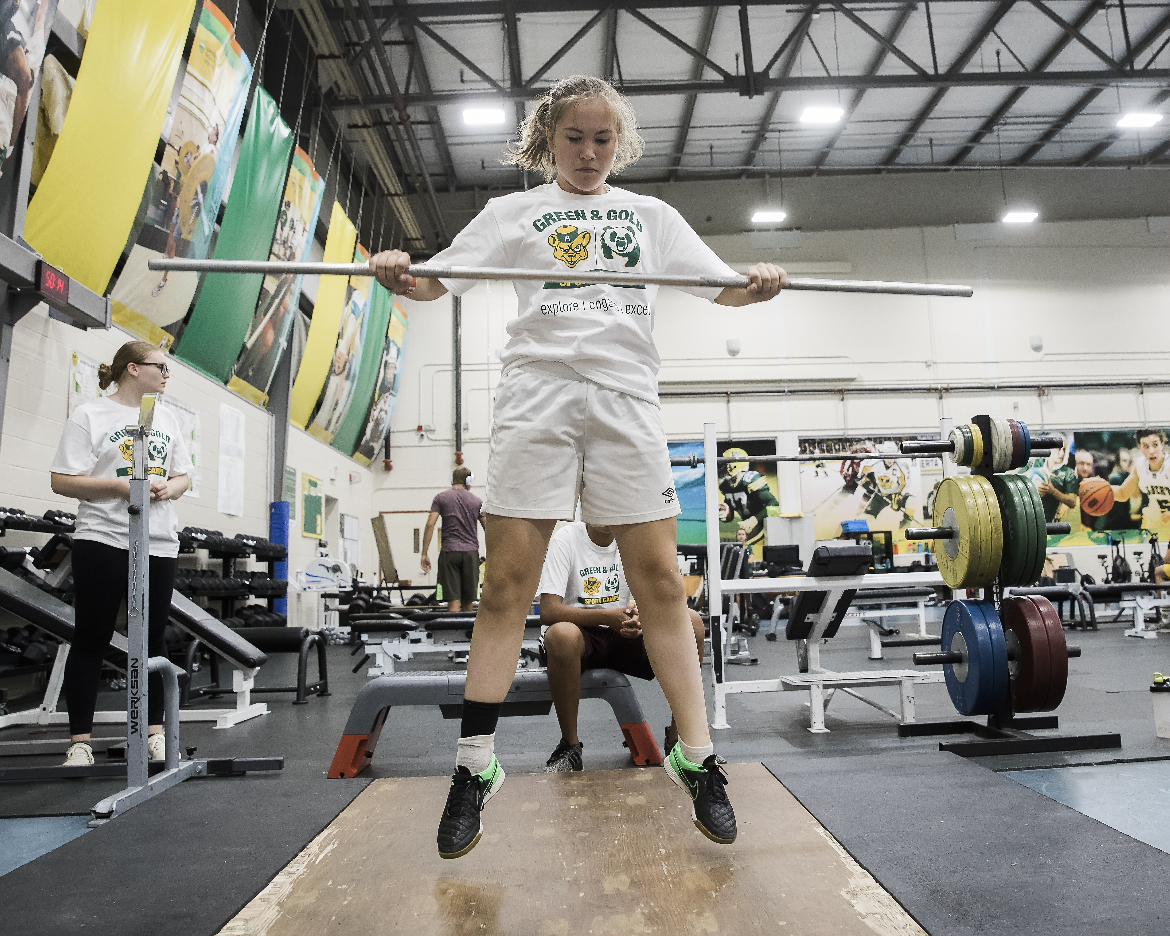 Green + Gold summer camp participant playing flag rugby