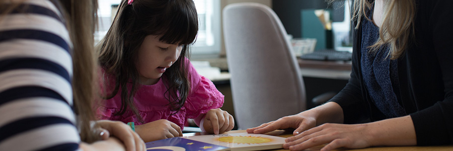 child playing with books