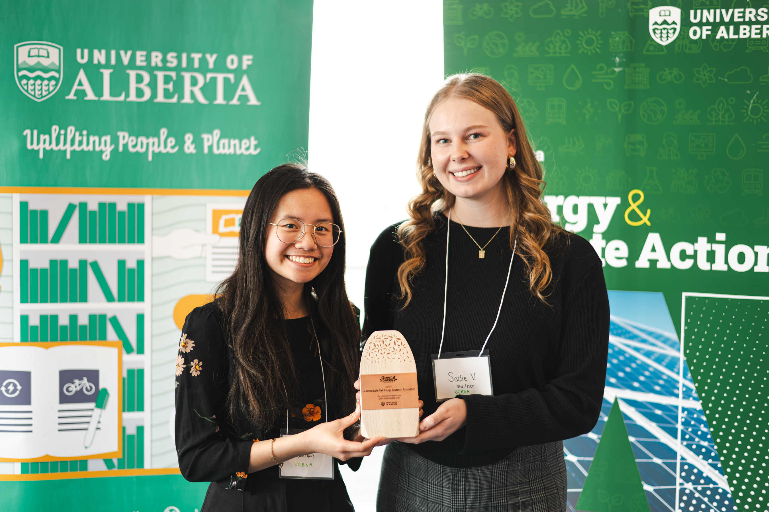 Team members of the Undergraduate Cell Biology Students’ Association smiling and holding their trophy