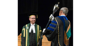 U of A Chancellor Doug Stollery with the University Mace