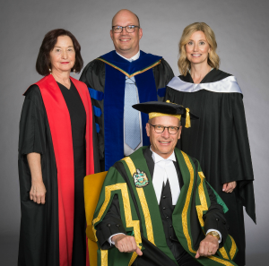 Chancellor Doug Stollery with his installation presenters the Honourable Sheila Greckol (left), Dr. Kristopher Wells (centre), and Ms. Carolyn Campbell.