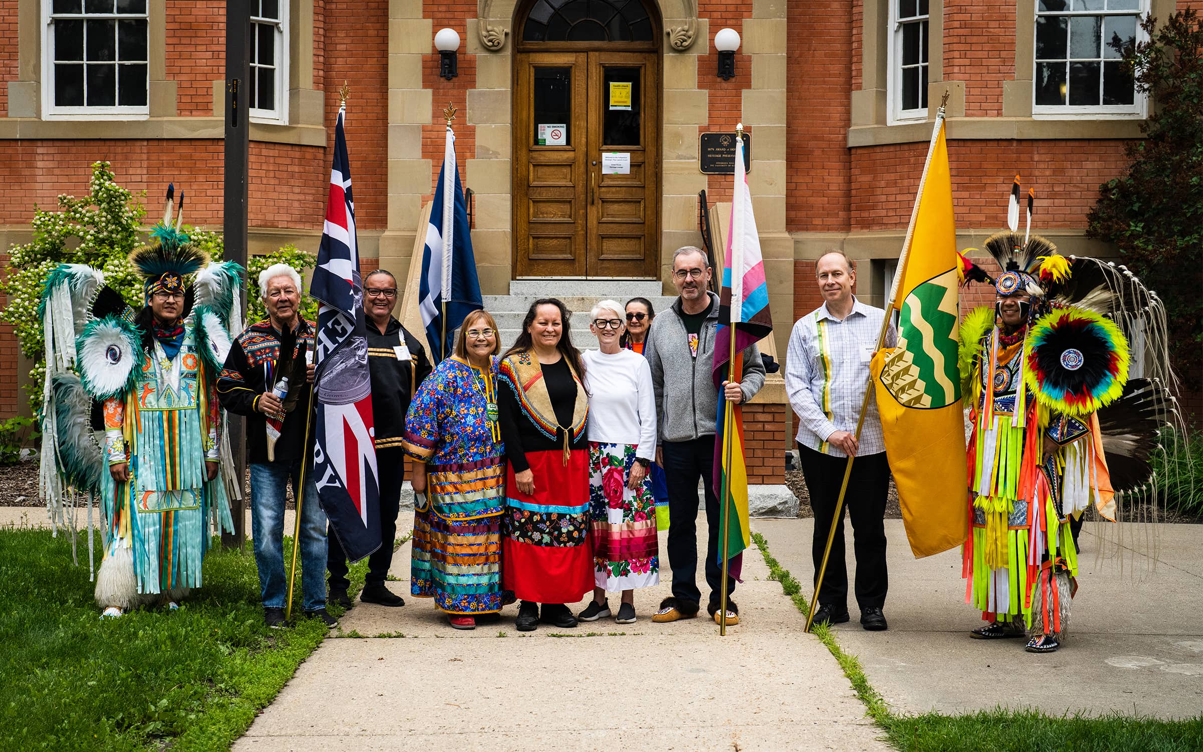 The Grand Entry poses before their entrance.