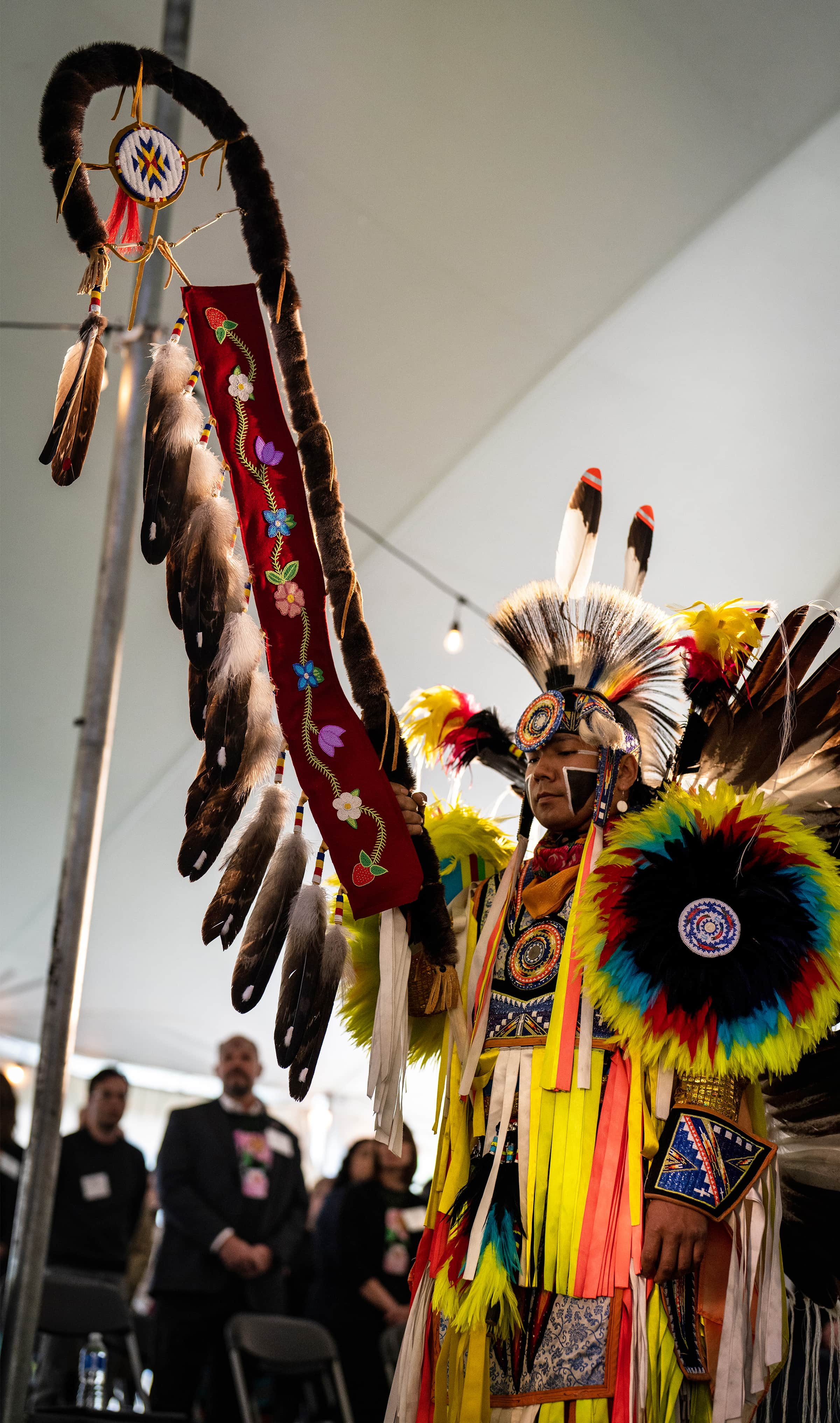 Marcus Pahtayken carries an Eagle Staff in the Grand Entry.