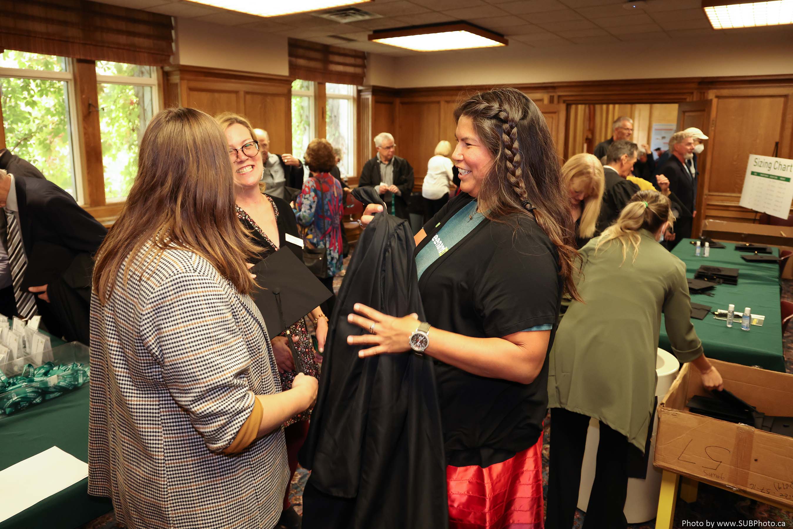 Guest are given caps and gowns as part of the Cap ‘n’ Gown celebration