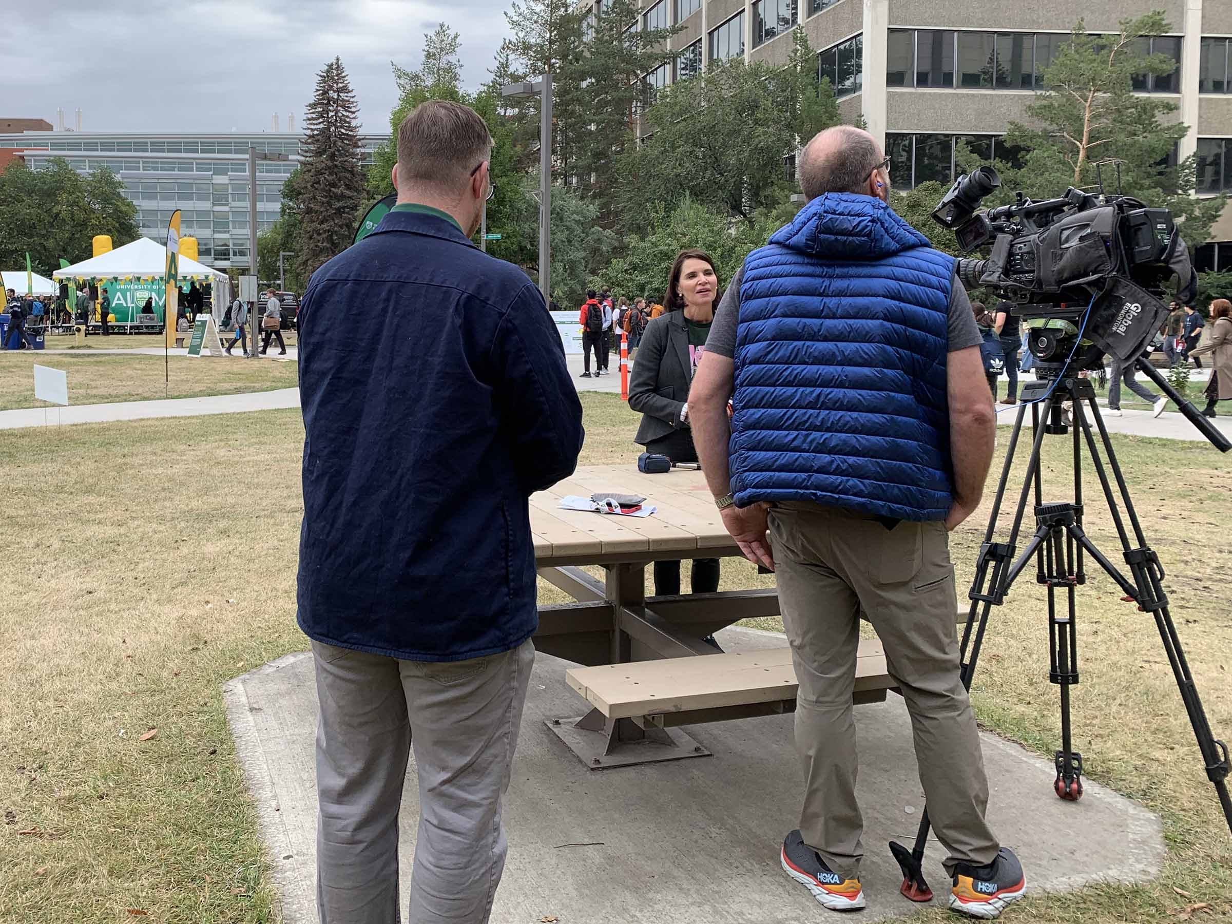 Ross Neitz, Media Relations Strategist, supporting Vice-President External Relations Elan MacDonald during an interview with Global Television