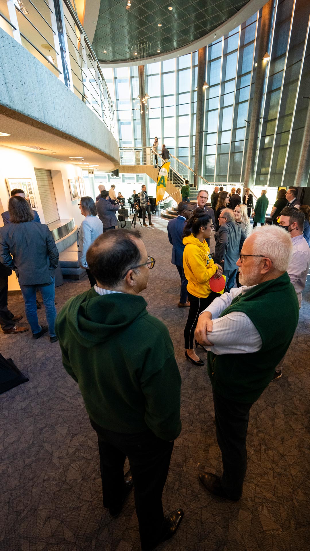 Members of the university community network at the opening reception at the Timms Centre