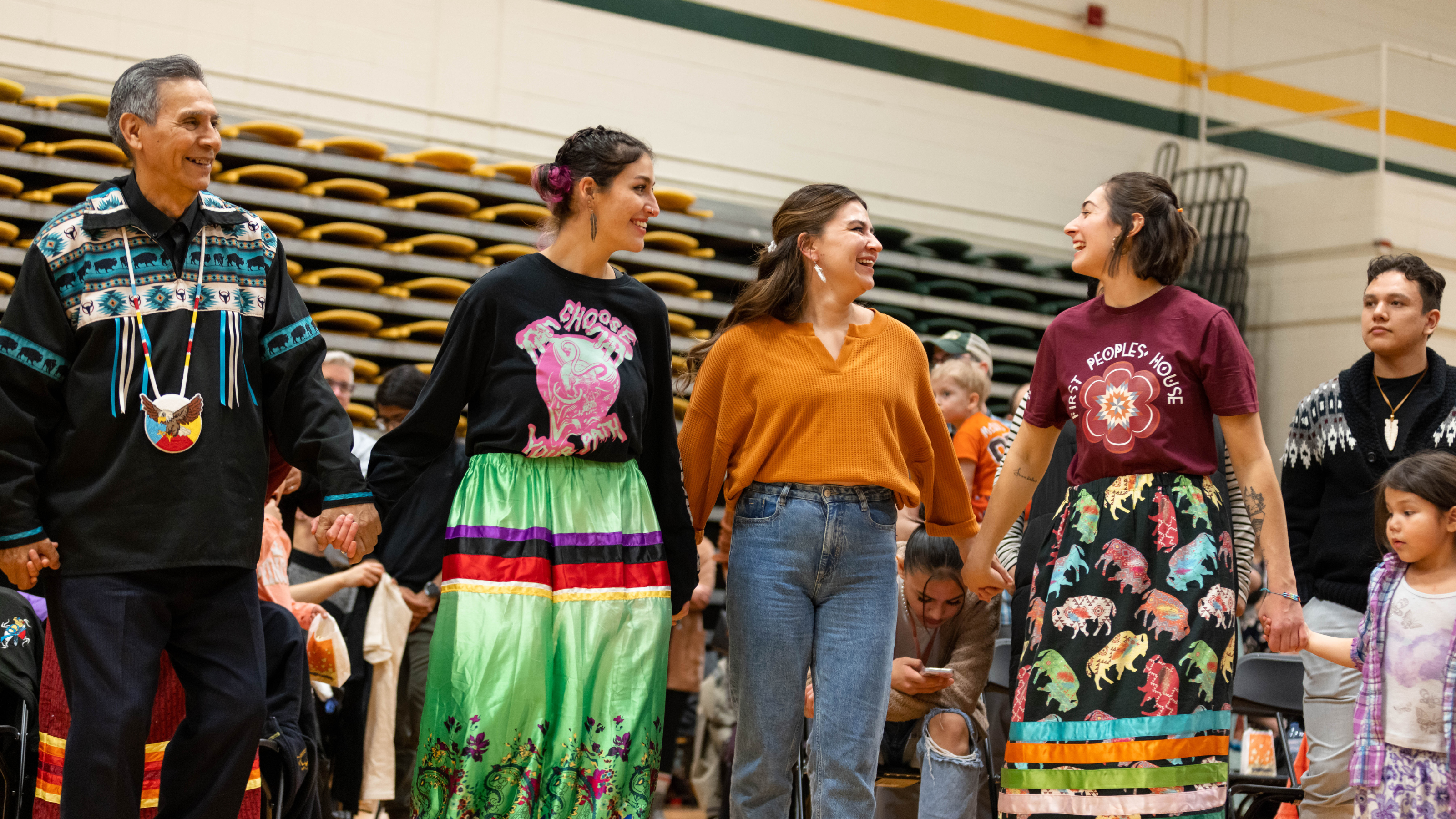 people in a round dance at the U of A