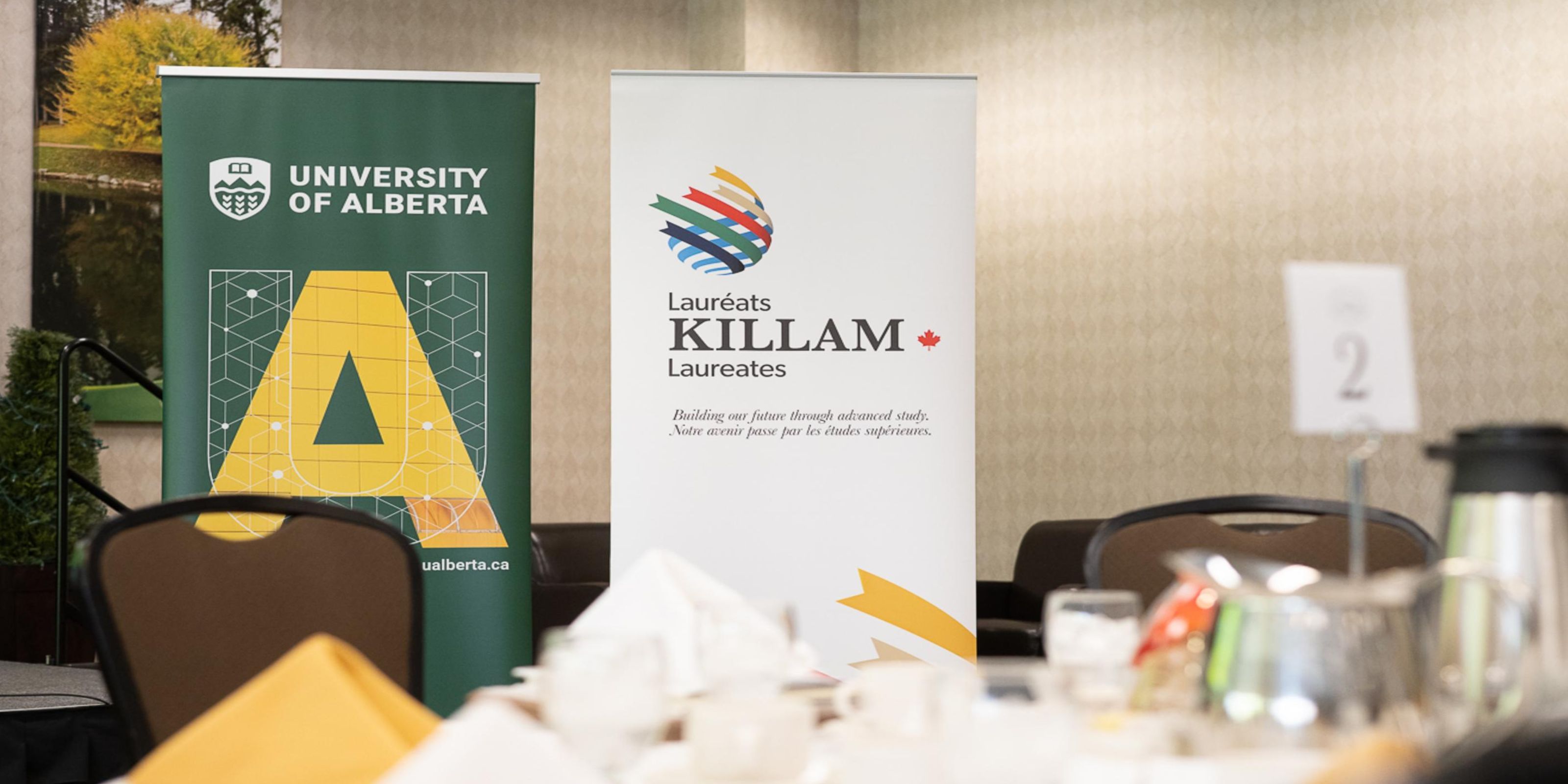 Killam awards banners at the event by a table