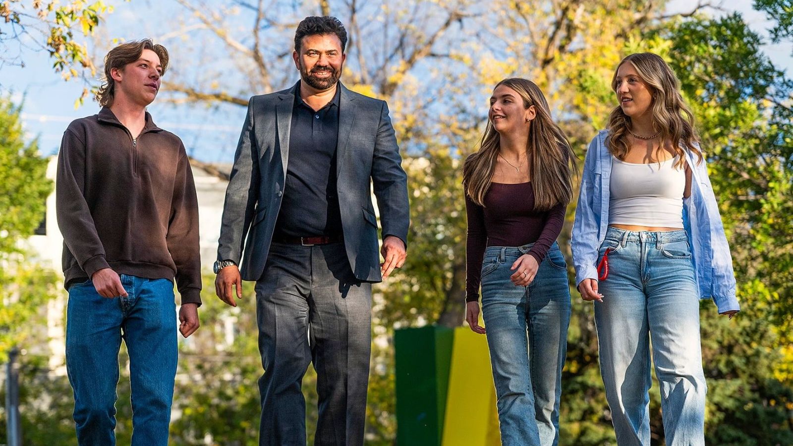 Sofyan Alhamid (middle left), lecturer at Campus Saint-Jean Académique, chats with students Joshua Blais (left), Sama Bitar (middle right) and Eden Bentz (right).